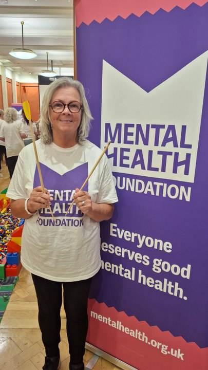 Carrick woman walks over broken glass for mental health charity
