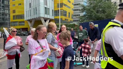 Police officers are now trying to persuade the women and children...