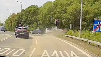 Dangerous driver smashes into car at roundabout during high speed chase