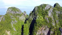 Pileh Lagoon Mountains from the Top Down. World Famous Maya Bay Beach, Wide Pan Left. Ko Phi Phi Le