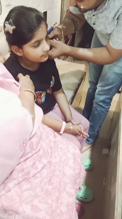 Cute girl ear piercing