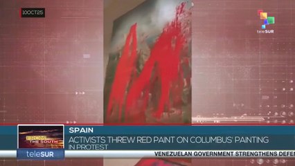 SPAIN l Activists threw red paint on Columbus' painting in protest