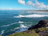 Surfers taking advantage of the waves at Tullan Strand, Bundoran, Donegal Bay