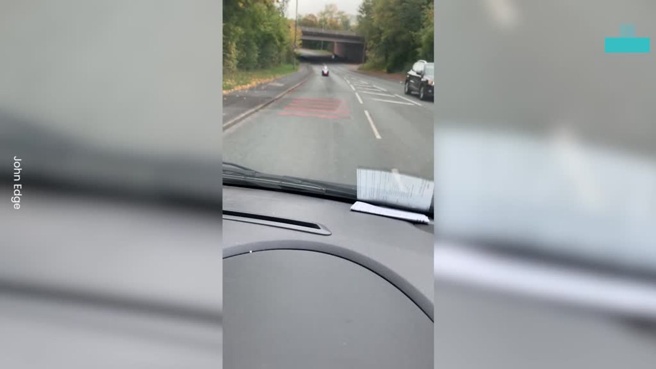 Bobsleigh Speeding Down Busy Road