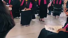 Mom Graduates with Son by Her Side
