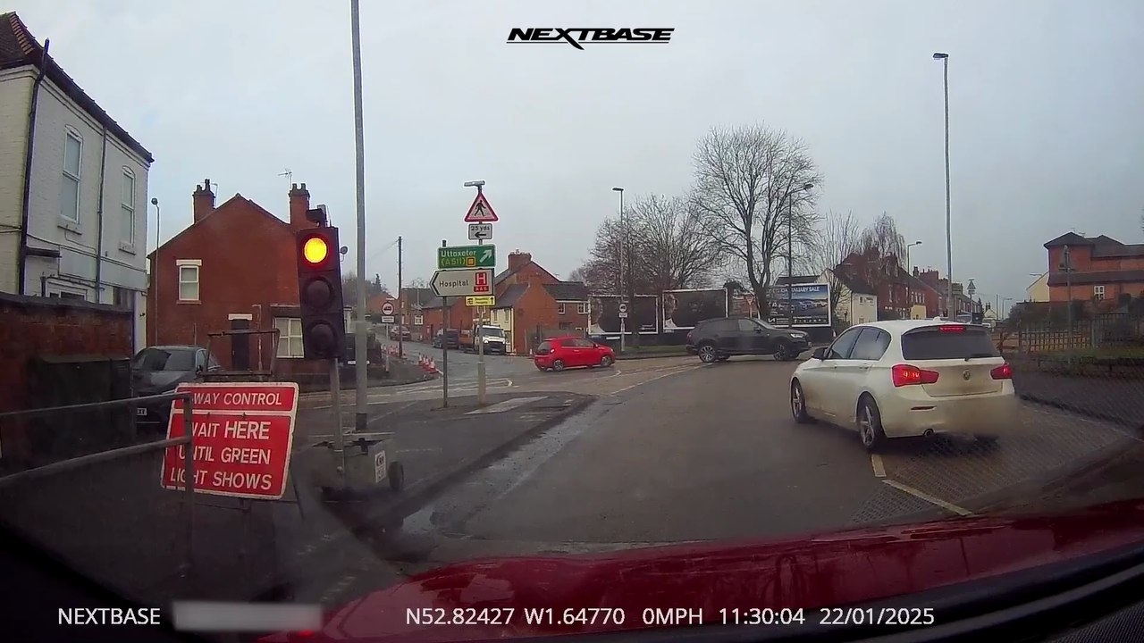 Cars running temporary red lights in Britain