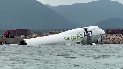 Cargo plane slides off runway in Hong Kong, media reports two dead