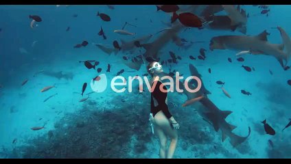 Woman Freediver in a Clear Tropical Water with Nurse Sharks in Maldives