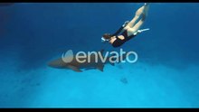 Woman Freediver Swimming Underwater with Nurse Shark in Blue Ocean at Maldives