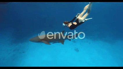 Woman Freediver Swimming Underwater with Nurse Shark in Blue Ocean at Maldives