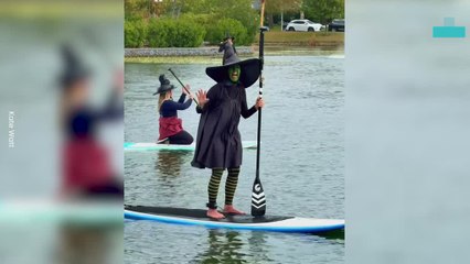 Witches Make Waves in Halloween Paddleboard Event