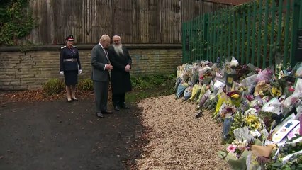 King Charles pauses to view floral tributes for victims
