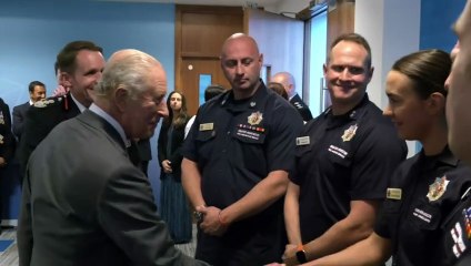 King Charles greeted by first responders during police visit