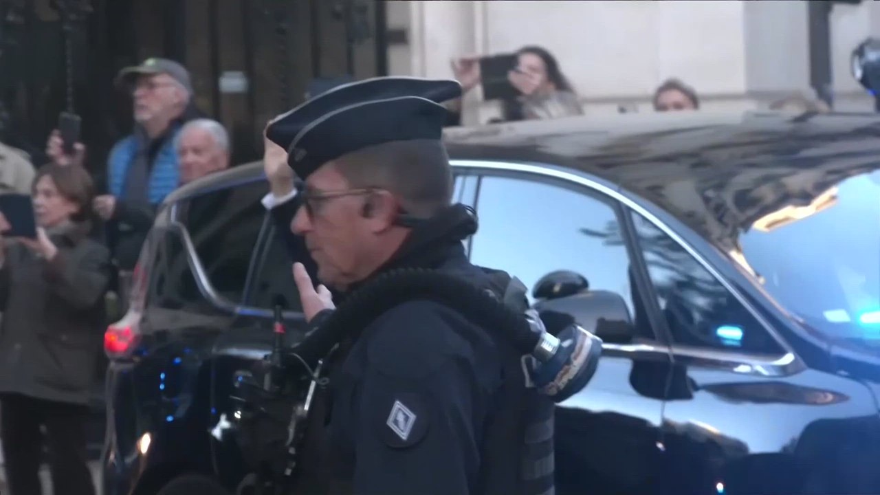 France's Sarkozy waves to supporters as he heads to Paris prison