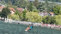 Skilled paraglider nails 360 landing on raft with smooth touches at Acro Show in Switzerland