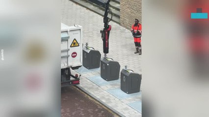 Sanitation Worker Operates Hidden Trash Machine