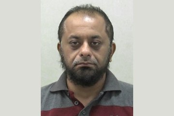 The moment a man throws boiling oil over police officers.