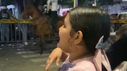 Young girl goes from singing with joy to being a silent part of audience when she notices the camera