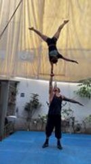 Woman Shows Incredible Strength Doing Handstand on Man's Hand