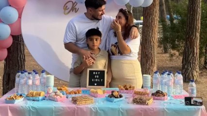 Little boy cries at gender reveal after baby boy is announced with blue confetti