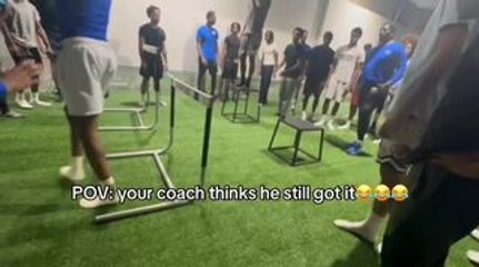Coach Crashes Into Hurdle While Trying to Jump