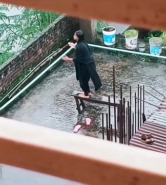 Girl Dancing in Rain on Rooftop Table… Until Gravity Wins 😂🌧️💃