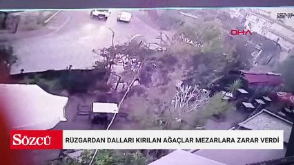 Rüzgardan dalları kırılan ağaçlar mezarlara zarar verdi