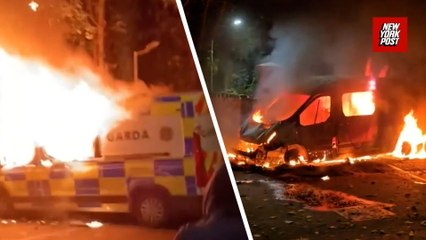 Anti-immigrant protesters burn Dublin police van after girl attacked