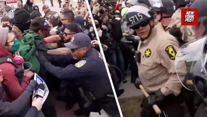 'They're hitting us with f–king sticks': Police scuffle with protestors outside Broadview ICE facility