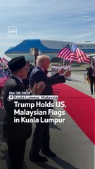 Trump Holds US, Malaysian Flags In Kuala Lumpur