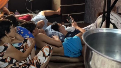 Perfectly-timed prank with steel pot startles every family member during suspenseful movie scene