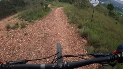 Cyclist enjoying fast ride down a trail is forced to brake quickly after spotting hikers