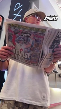 Giants QB Jaxson Dart reading today’s New York Post during Crocs TikTok Shop takeover in SoHo