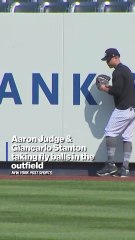 Yankees big fellas are out taking fly balls for very different reasons