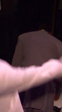 David Stern trying on LeBron James' suit jacket during the 2003 NBA Draft