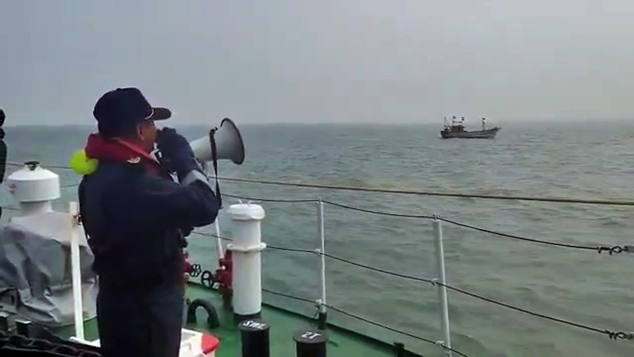 Indian Coast Guard Team cautioning Fisher Boat/Fishermen about bad weather and advise them of safety
