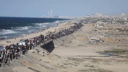 Displaced Palestinians head back to shattered homes as Gaza ceasefire holds