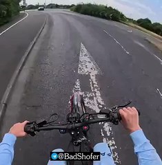 Heart-stopping moment e-bike rider nearly plunges off motorway bridge