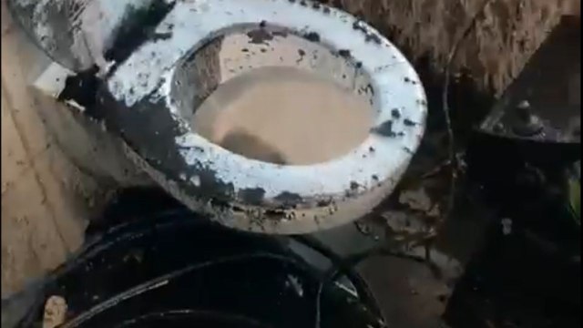 Old greasy kitchen pipe bursts and floods the bathroom with sticky grease