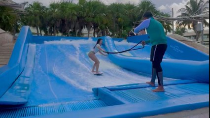 Girl tries Flowrider at Moon Palace Cancun and finally manages to stay upright