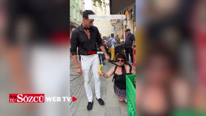 İstanbul'da tartışma yaratan görüntü: Sevgilisini 'kedi' gibi gezdirdi