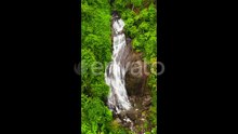 Aerial Drone of Waterfall in the Tropical Mountain Jungle Kuda Falls Sri Lanka1