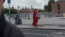 Man tries to keep calm during stroll while woman across the road yells into her phone