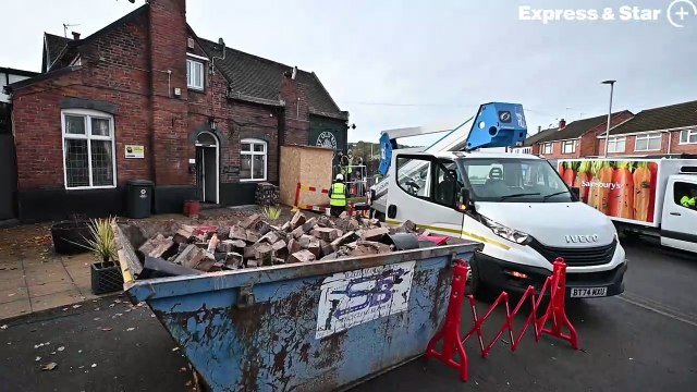 The Old Bush in Swindon near Dudley was struck by a car and the building was being made safe by taking some of the height off the chimney where the car hit.
