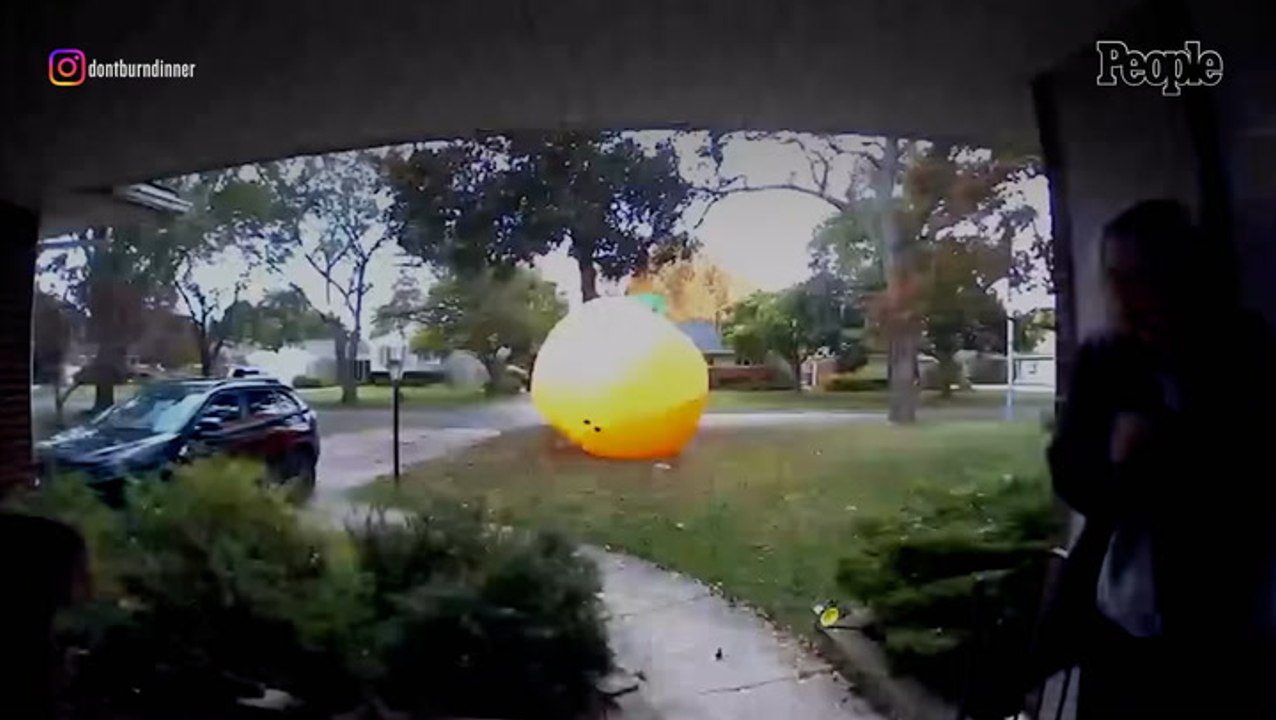 Mom Tackles Inflatable 20-Foot Pumpkin as It Bl...