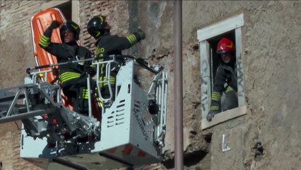 A medieval tower in Rome partially collapses with a firefighter inside