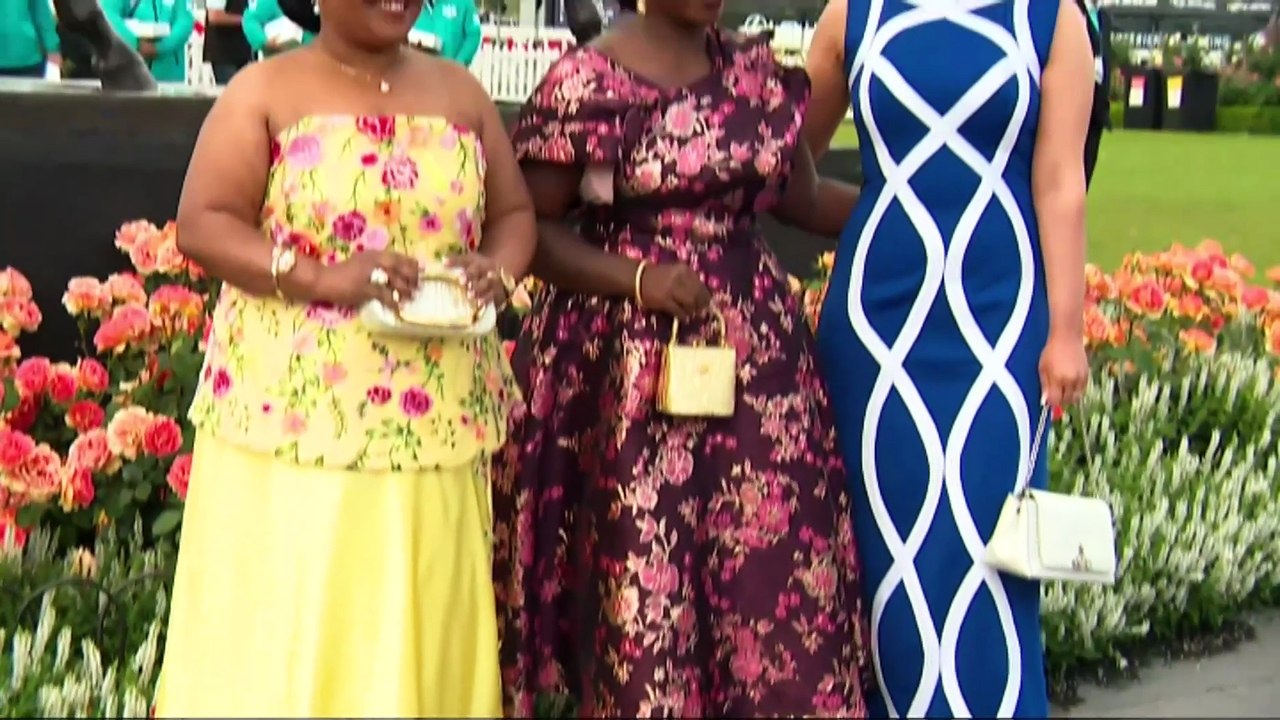 Wet, windy and cold as thousands flock to Flemington for the Melbourne Cup