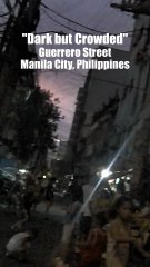 Dark but Crowded Guerrero Street in Manila City in the Philippines