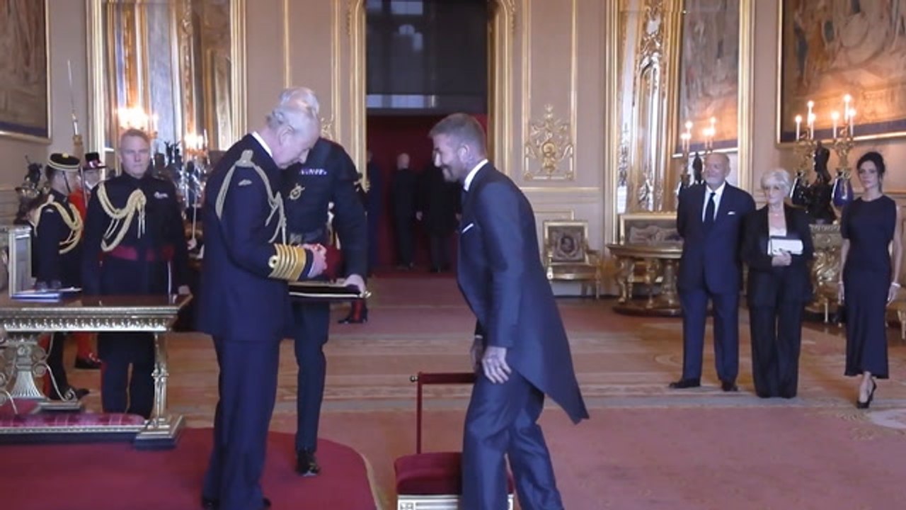 Sir David Beckham! England legend receives knighthood from the King as proud Victoria watches on