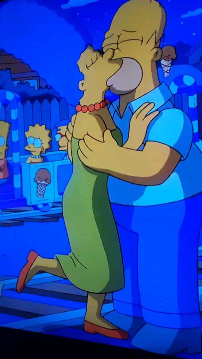 Homer and Marge Simpson are hugging/Boyfriend and Girlfriend/Husband and Wife/The Simpsons